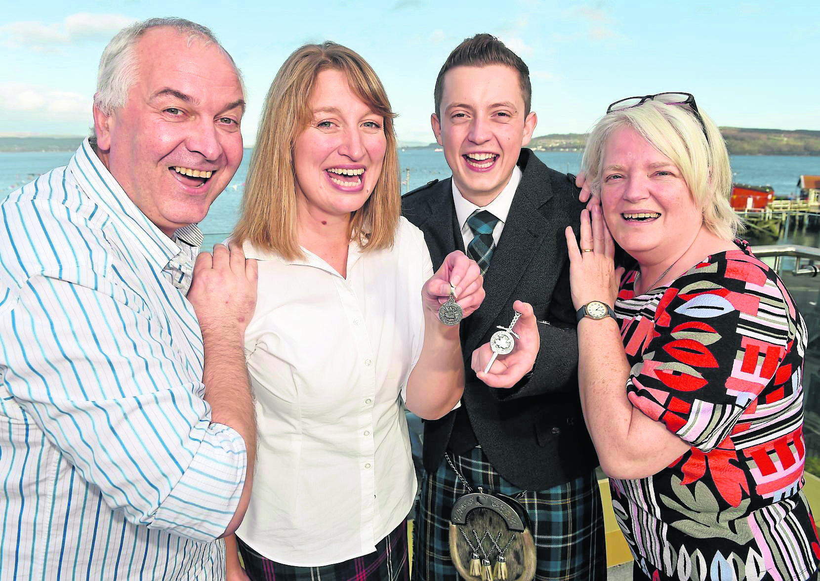 Winners of the Silver Pendants for singing, Eileen Duncan and Mickey MacEanraig - with music tutor Raymond Bremner and Gaelic tutor Christine Stone.