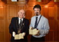 Lord Provost Barney Crockett and Ruaraidh Wishart, senior archivist at Aberdeen City and Aberdeenshire Archives, with the collection