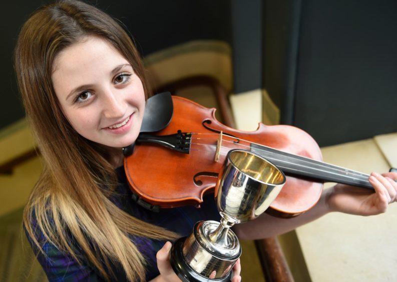 Abbie Morris from Port Ellen, Islay, winner of the Robert MacCallum Memorial Trophy for playing a Slow Gaelic Air and March, Strathspey and Reel in the 13 - 18 age category.