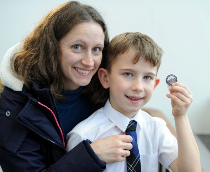 Calvin Fraser of Condorrat Primary School with mum Alison and his Gold Badge for singing a prescribed song in the under 7 age group.