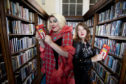 PROGRAMME LAUNCH OF BOOK WEEK SCOTLAND 2018
Book Week Scotland 2018 runs from 19 November to 25 November
Pictured
Drag Queen Nancy Clench with author Claire Askew holding  the Book Week Scotland Rebel Book at The Edinburgh Central Library.

The programme for Scotland’s seventh national celebration of books and reading was launched today, Wednesday 3 October, with a photocall of rebellious librarians held at Central Library, Edinburgh. Drag queen and Book Week Scotland ambassador, Nancy Clench, and bestselling author Claire Askew posed with copies of the Rebel book, which features a story from herself, as well as others submitted from the public.
Working with a wide range of partners, Scottish Book Trust – the national charity changing lives through reading and writing – will deliver events and activities across the country during Book Week Scotland 2018, which runs from 19 November to 25 November, linked to this year’s theme of Rebel.
There are hundreds of free events taking place across many different local authorities, funded by Scottish Library and Information Council (SLIC). Authors holding events include: bestselling YA writer and activist Juno Dawson; crime writer Ann Cleeves and outdoors expert and broadcaster Cameron McNeish.
Rebel Book
Free copies of the Rebel book can be ordered via Scottish Book Trust’s website. 100,000 copies have been printed and the book will also be available from libraries across Scotland during Book Week. The book contains 40 stories, including work from: bestselling author Sara Sheridan; playwright and performer Jo Clifford; Book Week Scotland ambassador and forensic anthropologist Professor Dame Sue Black, and Gaelic writer David Eyre.
An ebook and audiobook version of Rebel will also be downloadable from Scottish Book Trust’s website. Scottish Book Trust has once again partnered with Royal National Institute



Photograph by Martin Shields 
Tel 07572 457000
www.martinshields.com
© Martin Shields