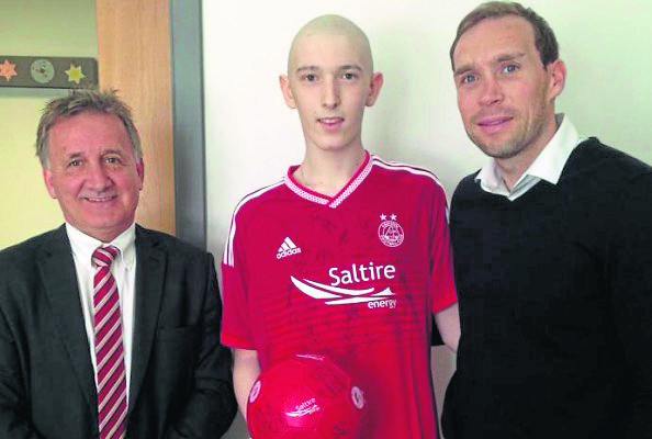 James Stewart, centre, with Aberdeen FC vice chairman George Yule and Russell Anderson.