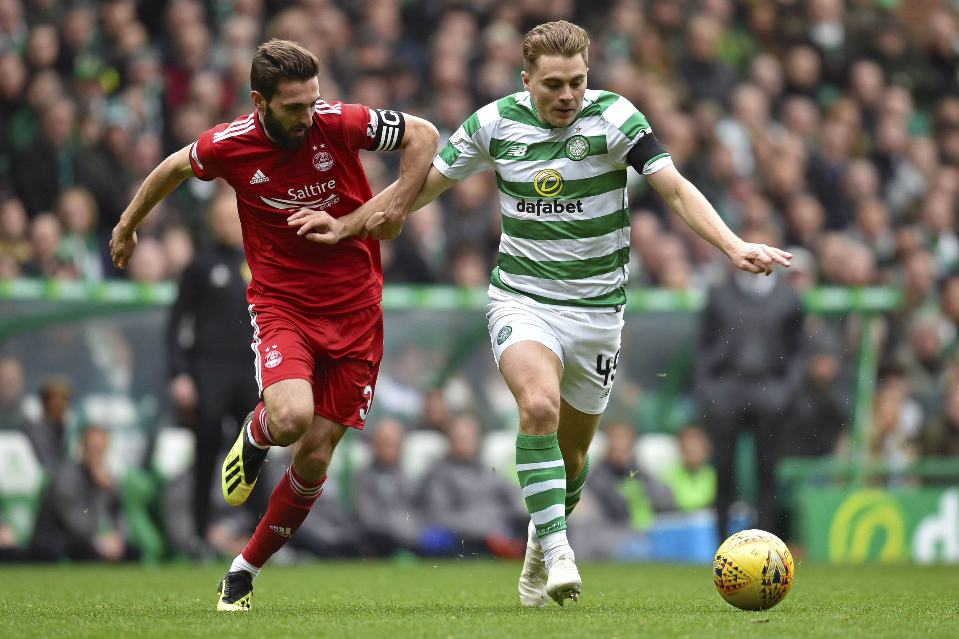 Aberdeen's Graeme Shinnie chases down Celtic's James Forrest