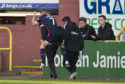 Ross County's Michael Gardyne is carried down the touchline against Dundee United.