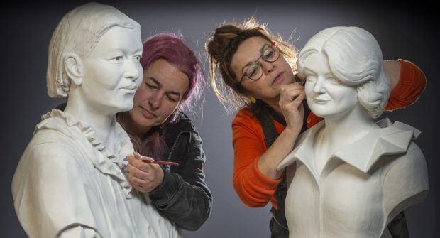 Sculptors Csilla Karsay and Graciela Ainsworth add the finishing touches to the busts of Mary Slessor and Maggie Keswick Jencks.