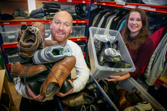 Scott Shand, owner of The Shand Practice, with Chloe Bartlett, volunteer co-ordinator at Aberdeen Cyrenians.