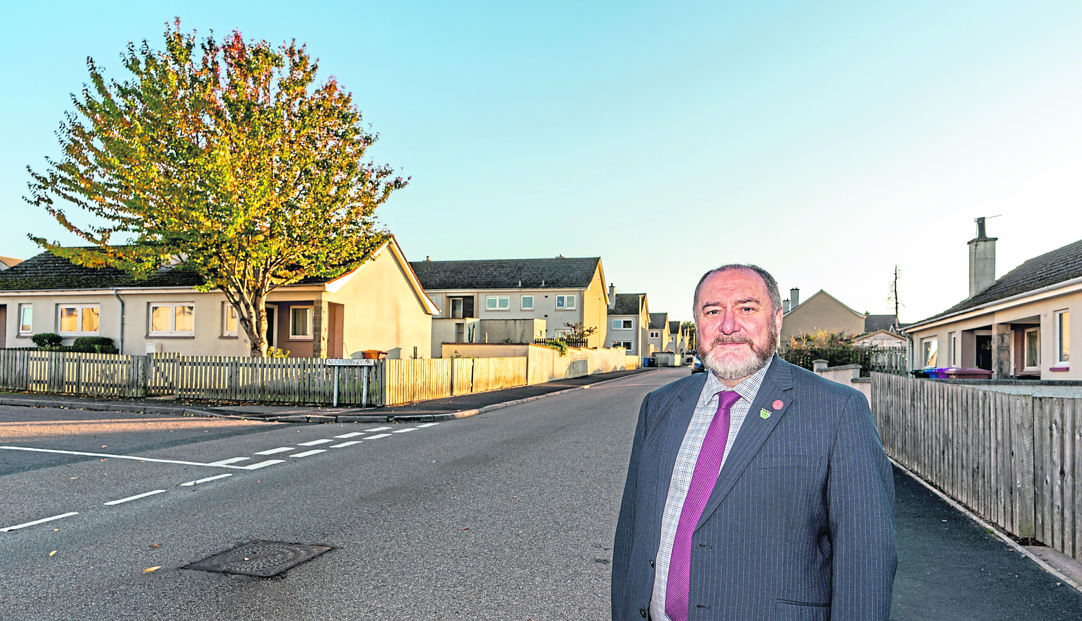 Councillor John Divers on Bezack Street at Anderson Drive, Elgin, Moray, where nails and tacks are being scattered on the carriageway.