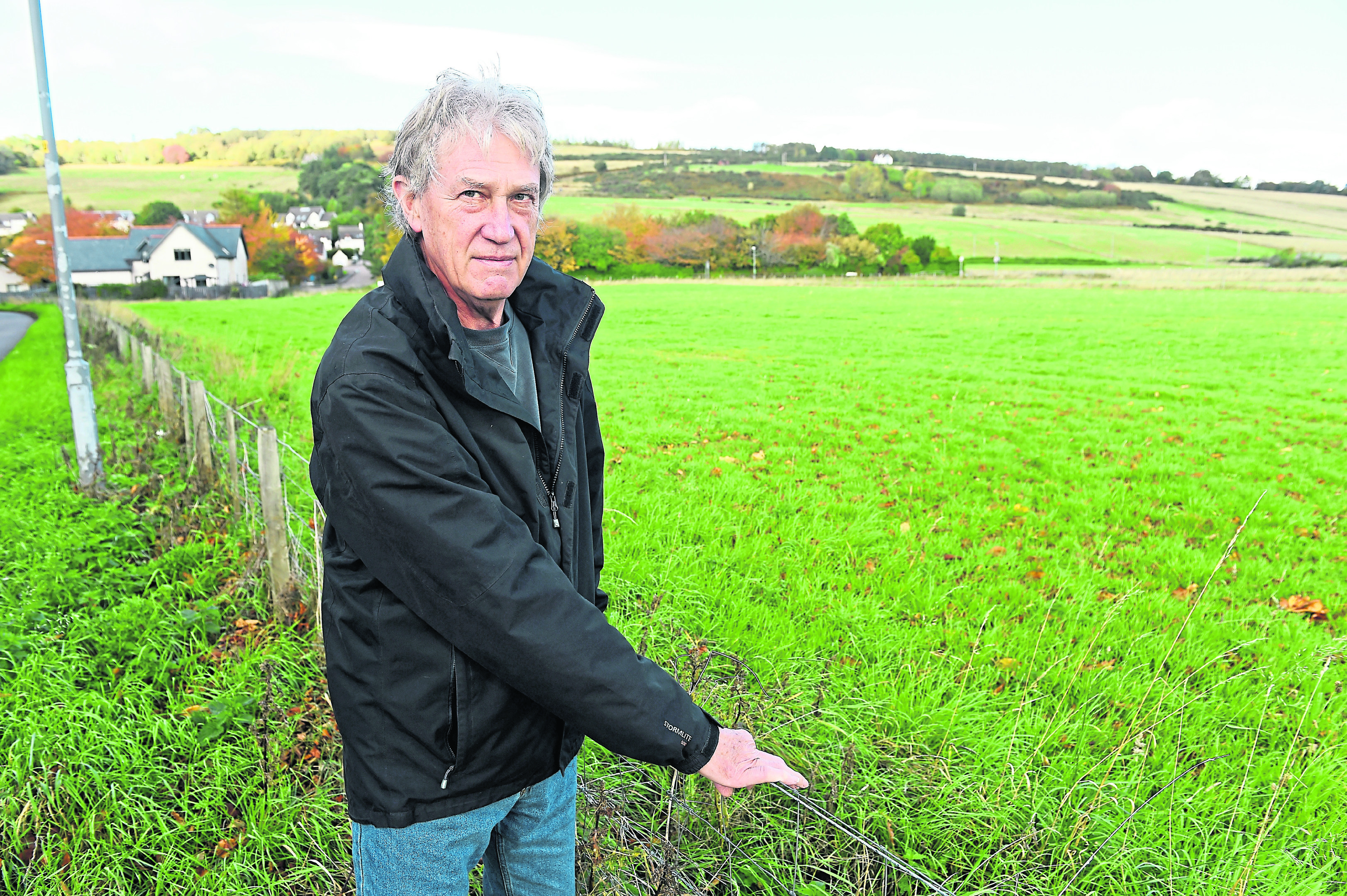 Fortrose Community Council Chairman, Tom Heath beside the field on the outskirts of Fortrose.