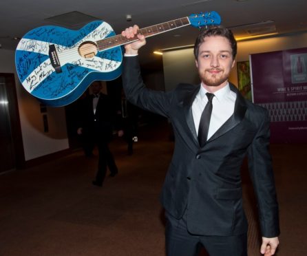 James McAvoy with guitar