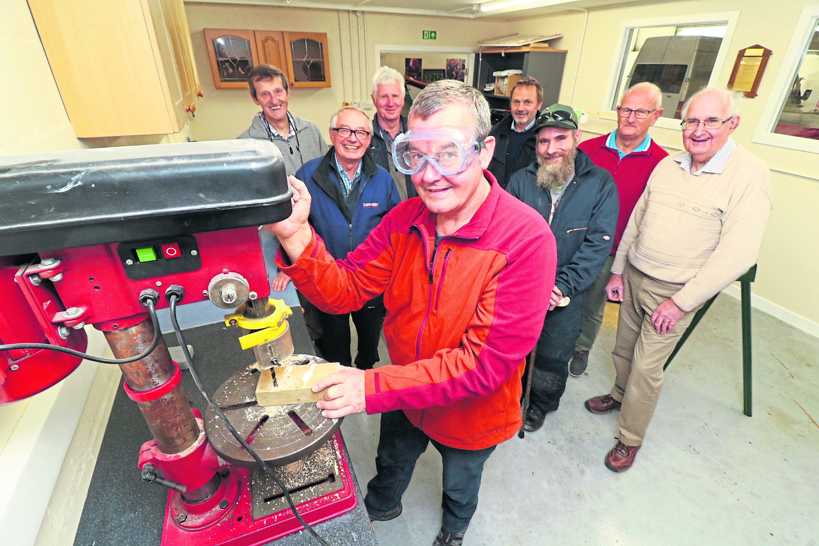 From left, Bob Johnston, Stewart Robertson, John Tuach, Steve Branwell, Peter 
Lawrence, George Smith, Don Holding, and John Ruickbie at the new Men’s Shed.