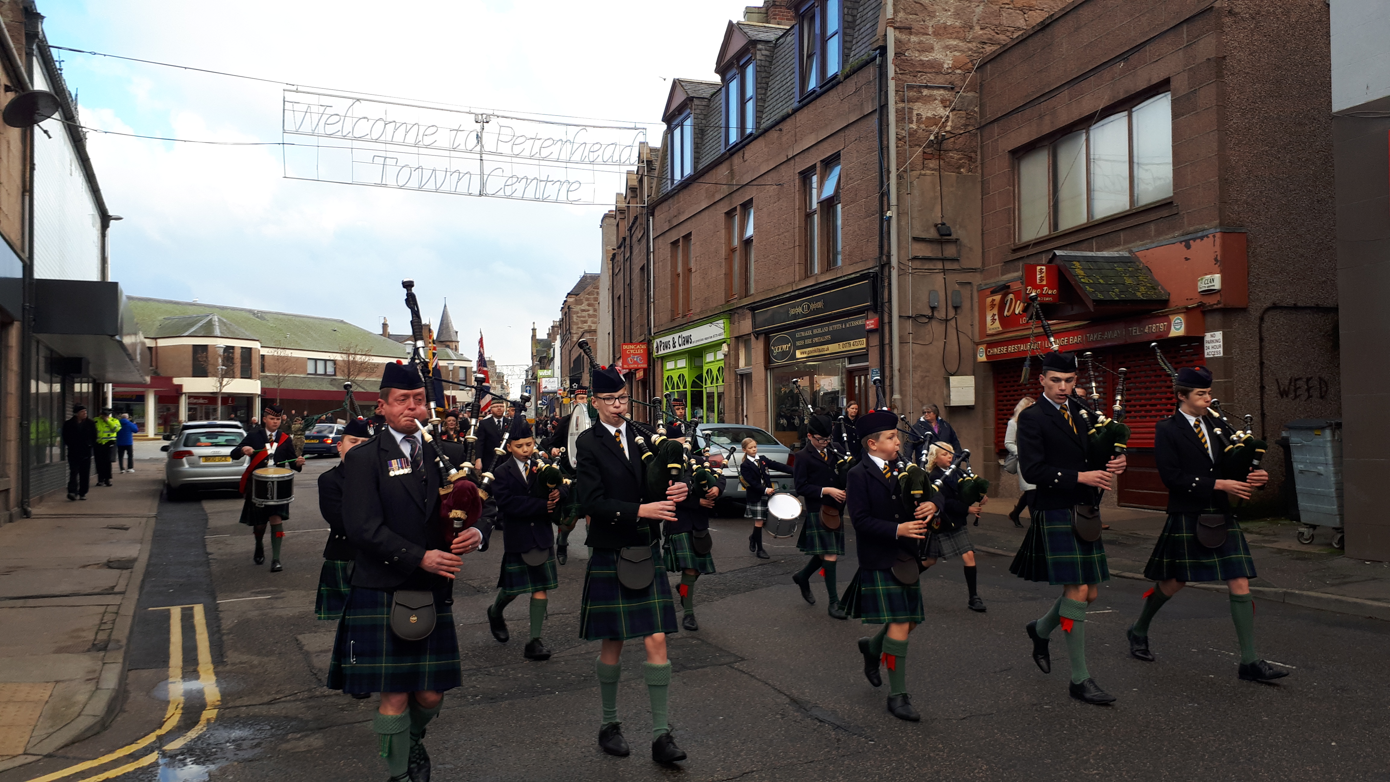 Robert Gordon's College pipe band led the parade around Peterhead.