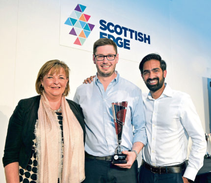 Scottish EDGE winners Douglas Martin and Shreekanth Ramanthan of MiAlgae with Fiona Hyslop MSP.