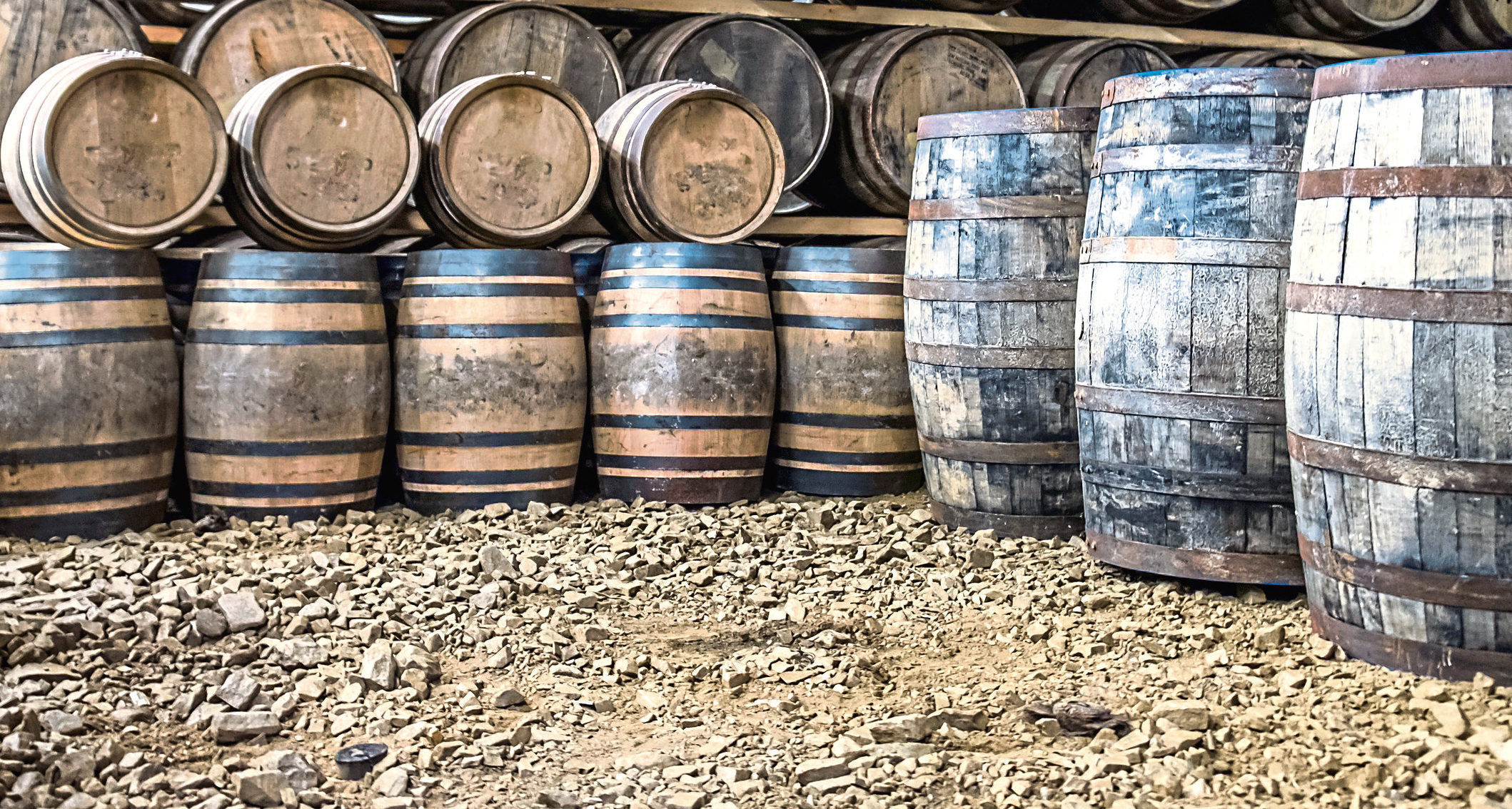 Whisky barrels in warehouse storage.