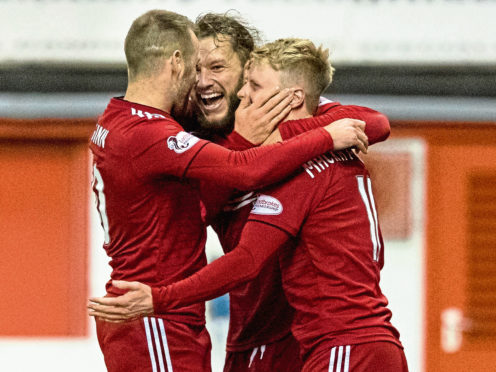 Gary Mackay-Steven of Aberdeen celebrates after scoring opening goal with Stevie May and Niall McGinn of Aberdeen.