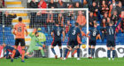 Dundee United's Paul Watson opens the scoring.
