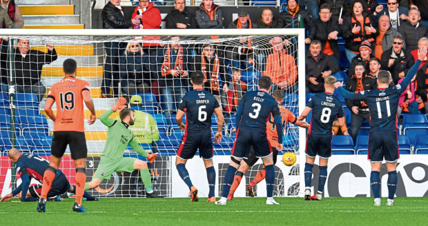 Dundee United's Paul Watson opens the scoring.