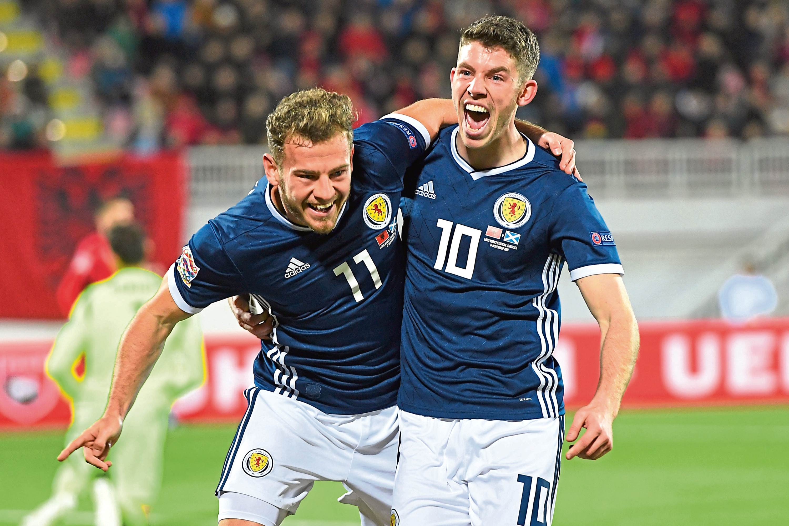 Scotland's Ryan Fraser (L) celebrates his goal with teammate Ryan Christie.