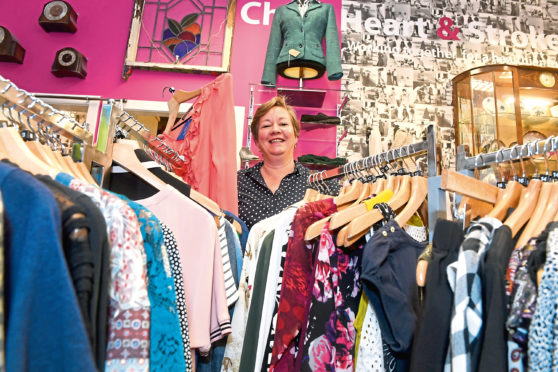Lesley Skinner sorts the stock at the Chest Heart and Stroke Charity Shop in Cults.