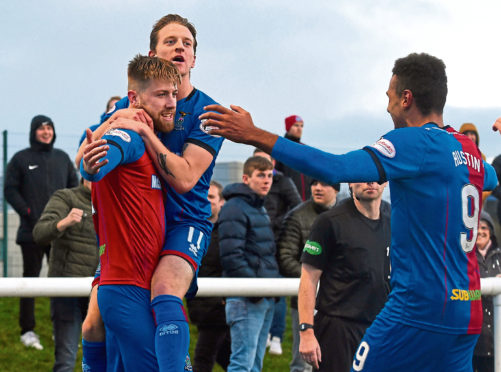 Inverness CT's Shaun Rooney (left) celebrates his goal with Tom Walsh and Nathan Austin (right).