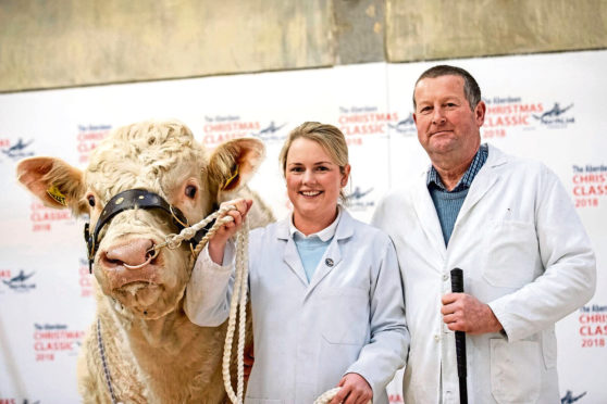 Anna Robertson and her father Iain from Lower Inchcorsie, Rothiemay, Huntly, with the 4,000gn Charolais bull Inchcorsie Nugget.