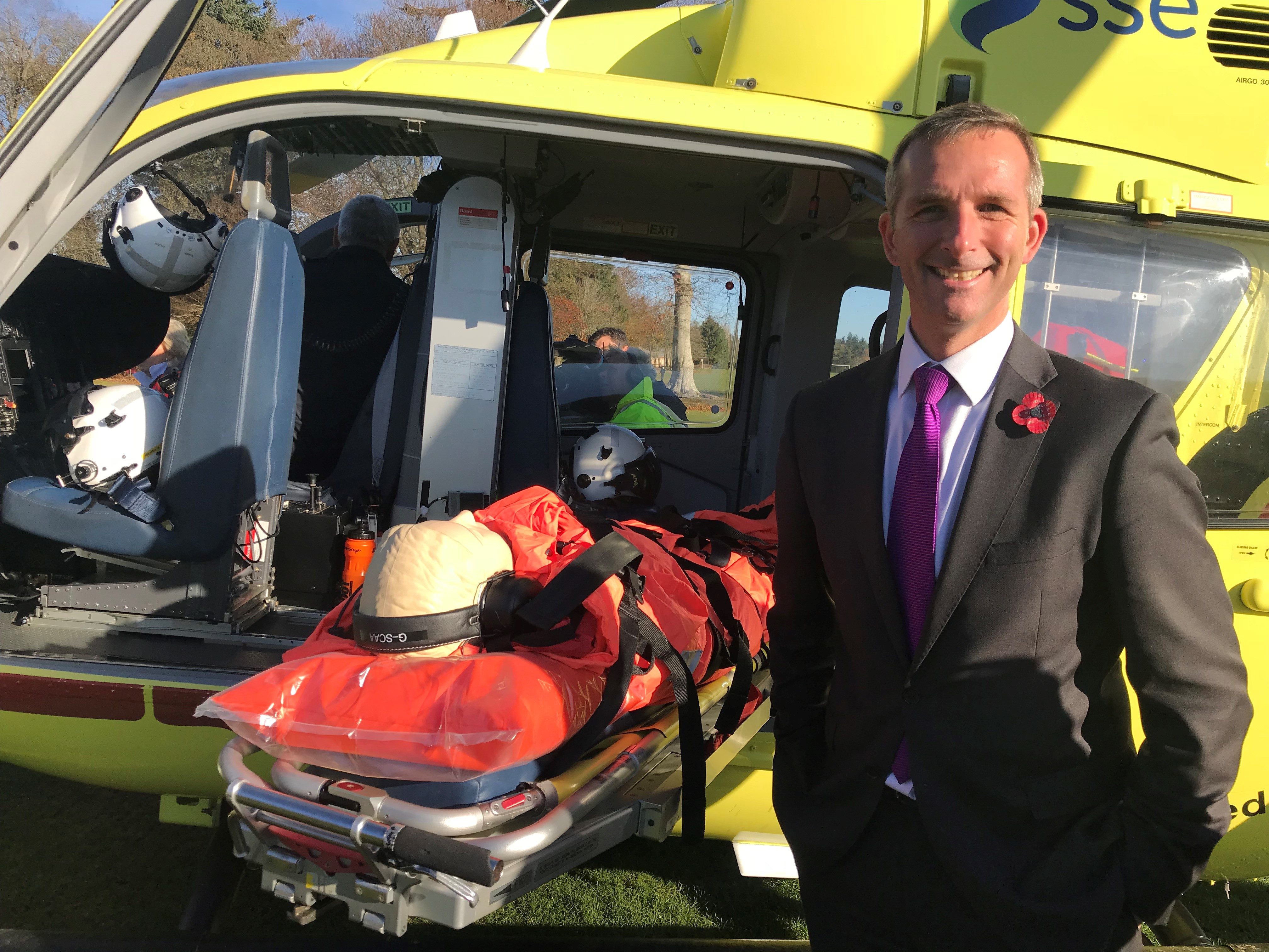 Liam McArthur with the SCAA helicopter