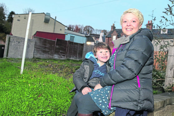 Evie Jack with her son Seamus Cormack at the site in Avoch where Evie hopes to open a tea room.