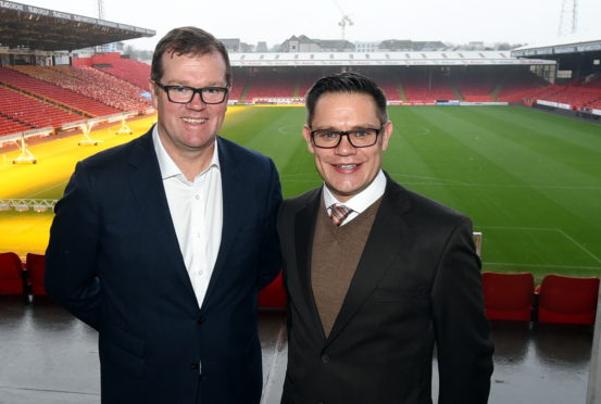 Rob Wicks, AFC commercial director, left ,and Courtney Marsh, CEO of the club's new health and wellbeing partner Health Shield.