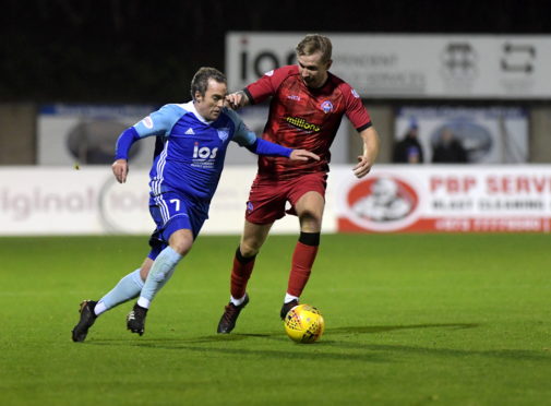 Jamie Stevenson, left, in action for Peterhead