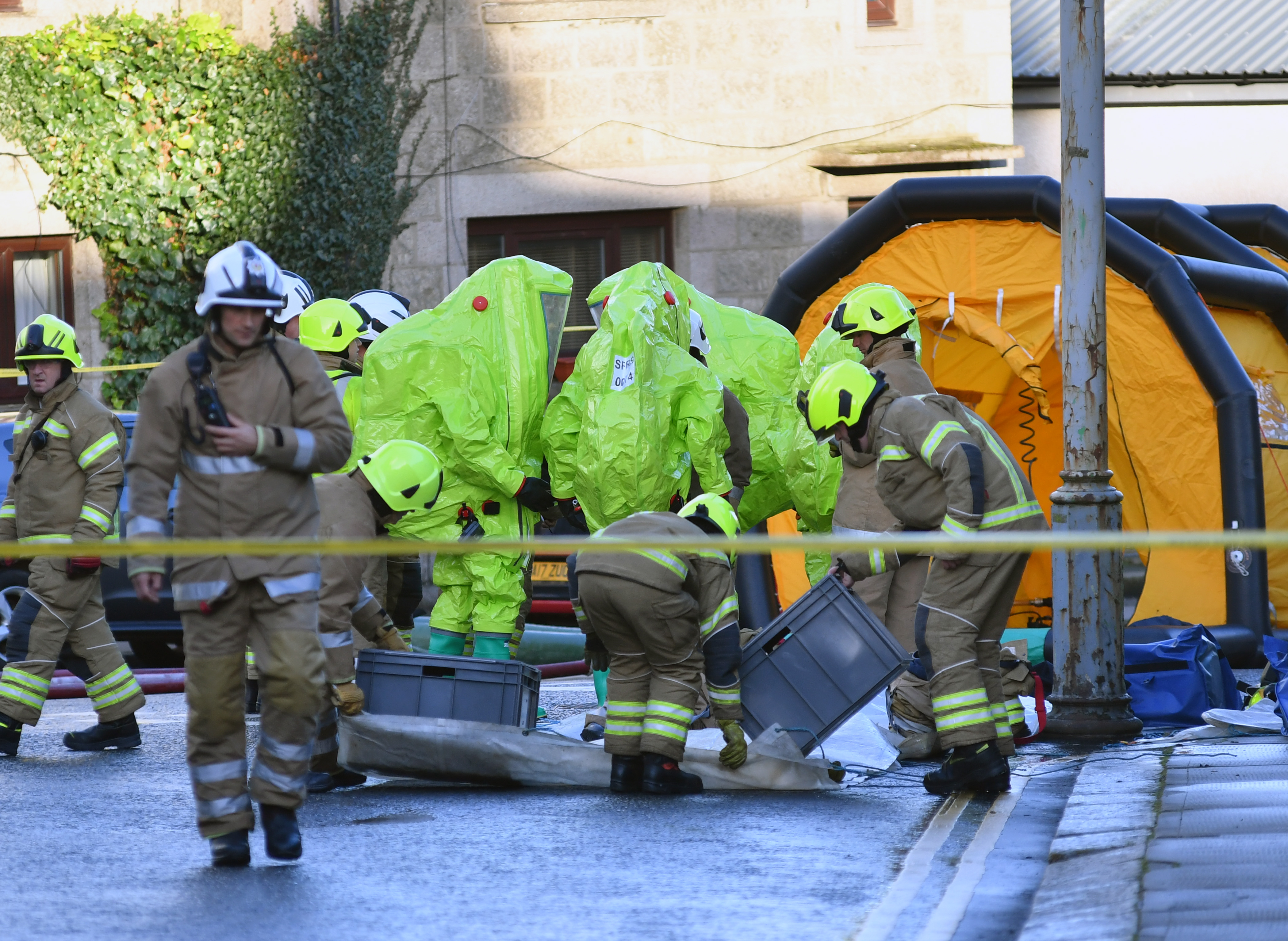 Firemen in bio-hazard suits prepared to enter a Fraserburgh launderette.