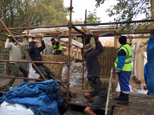 Young adults with learning disabilities have been helping to build a new office from straw bales.