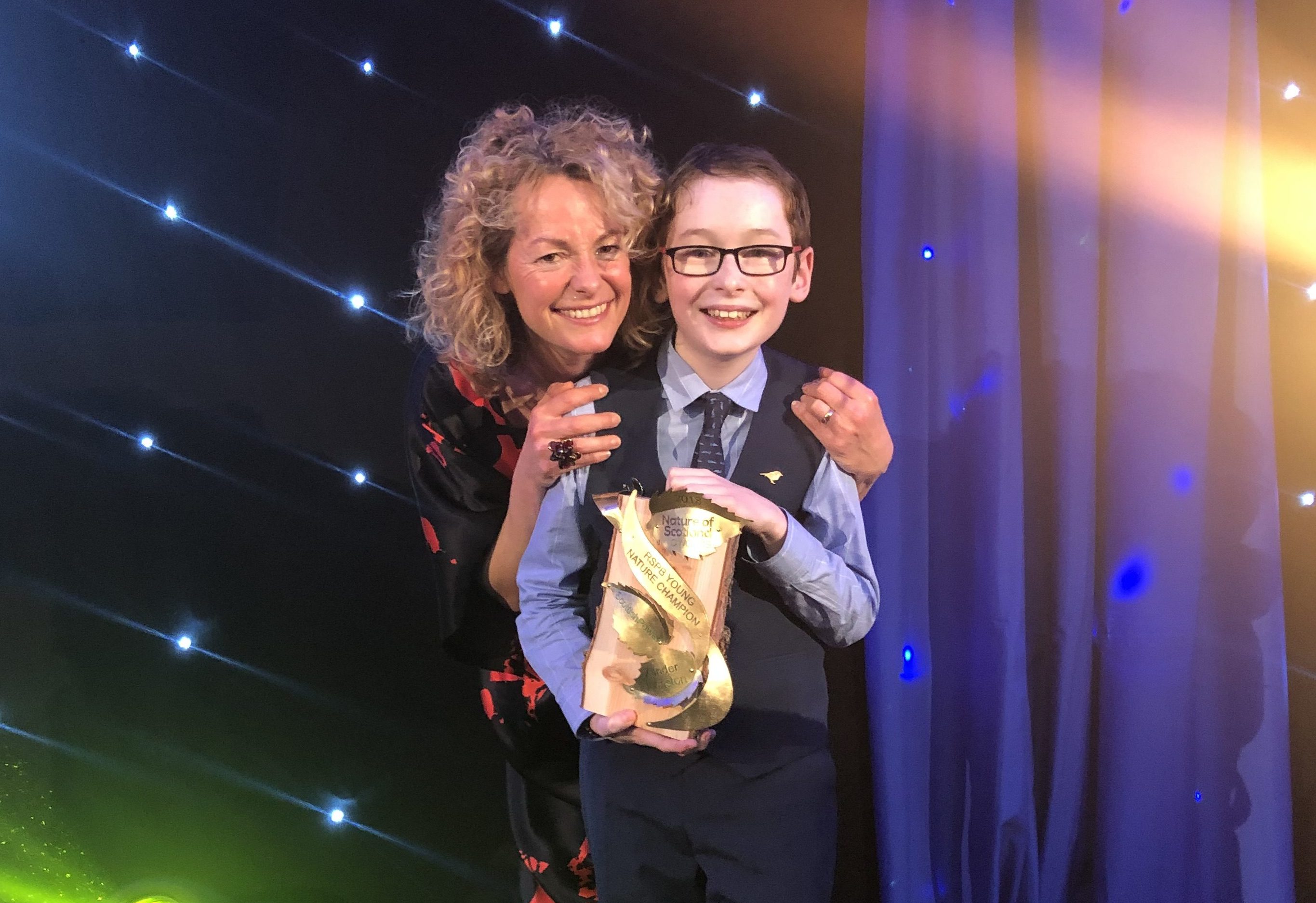 Xander Johnston receiving the RSPB award for Young Nature Champion.