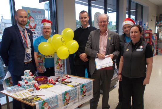 MSP Stewart Stevenson with Co-op managers, shopworkers and an USDAW area organiser during a visit to the Banff store this week