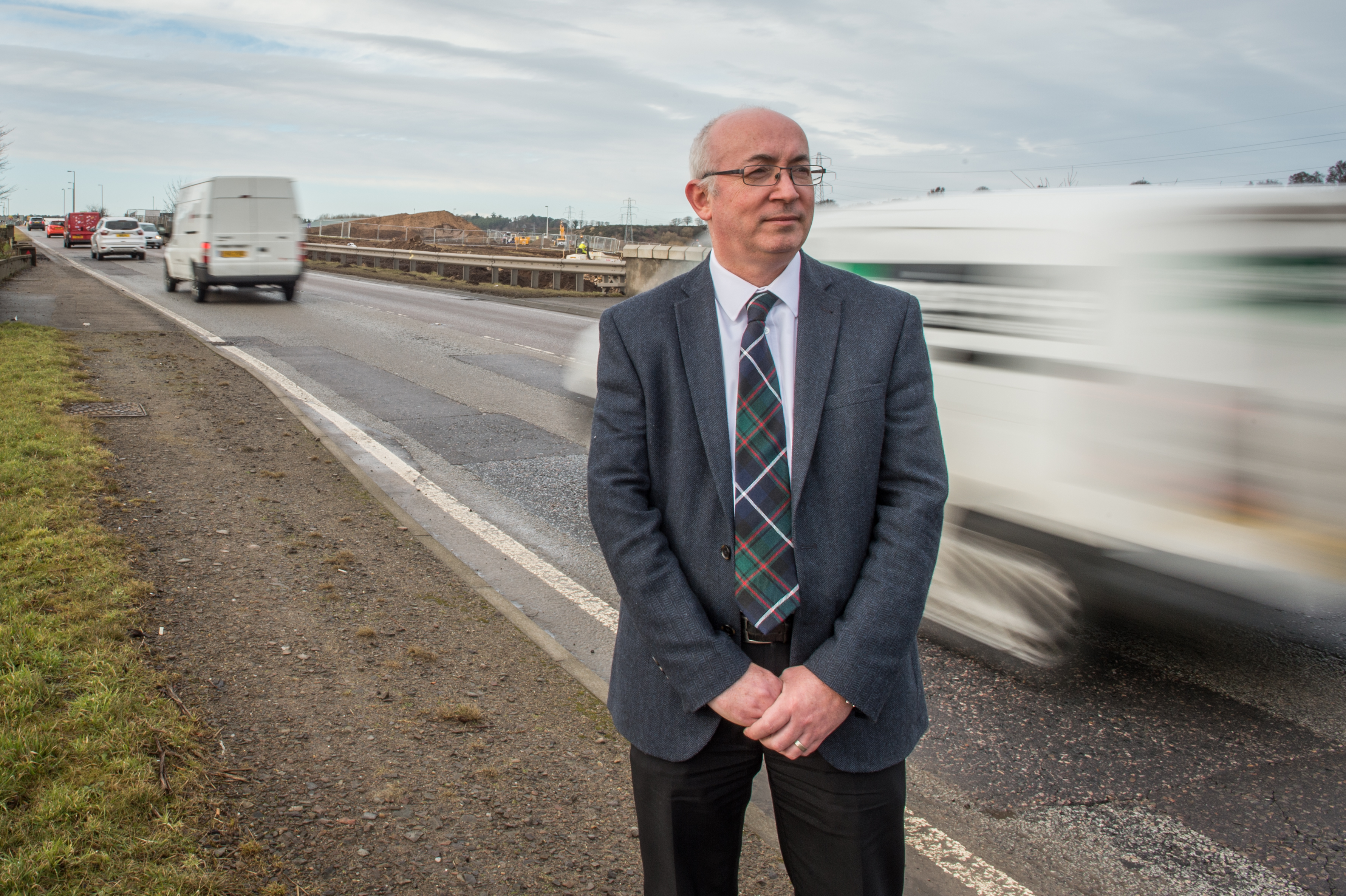 Fochabers Lhanbryde councillor Marc Macrae next to the A96 near Elgin.