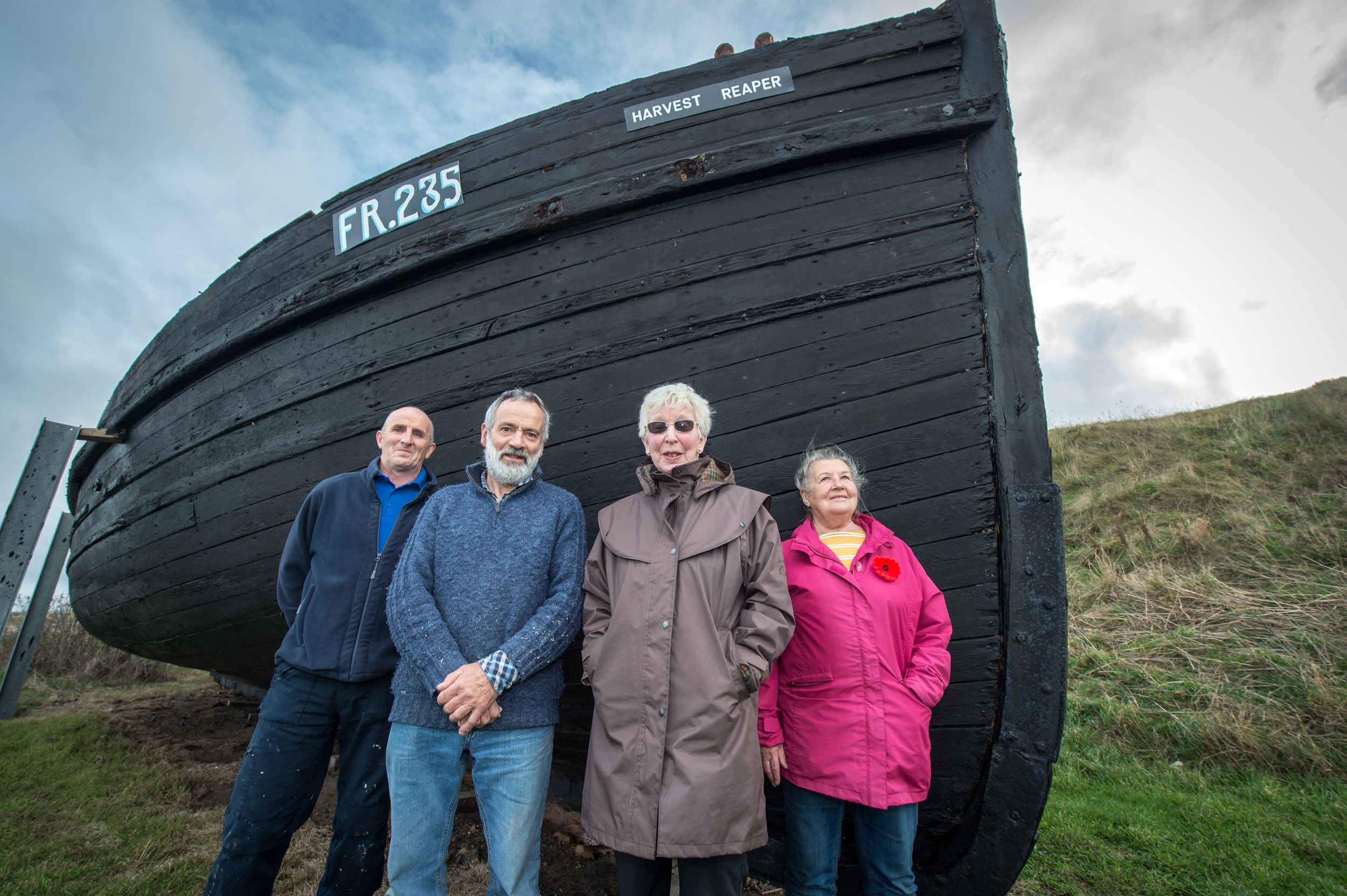 The newly-restored Harvest Reaper fishing vessel in Burghead with (L-R) - Peter Wilson (Senior Supervisor for Criminal Justice) Dan Ralph (Burghead Headland Trustee) Cath Miller (Secretary of Burghead Headland trust) and Hiliary Gloyer (Chair of Headland site)

Picture by Jason Hedges