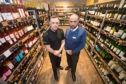 New campaign launched to raise awareness of proxy purchasing alcohol. L2R: Licensing Inspector North-East Division Kenny McGeough and Mark Watkins M&S store manager