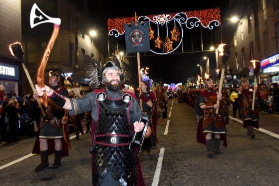 Guizer Jarl Ian Bray parades down Union Street