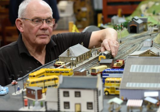 Dusty Millar from the Moray Model Railway Group demonstrates the display, which is modelled on the north-east of Scotland.