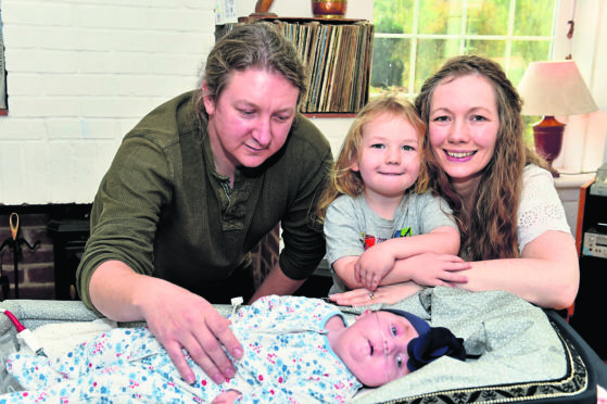 One year old Willow Scanlan was born with a heart defect and recently received life-saving surgery to repair her heart. She is pictured with Dad David, Mum Gina and son Jude, 4.
Picture by Colin Rennie.