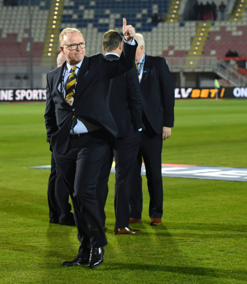 Scotland manager Alex McLeish takes to the pitch ahead of kick-off.