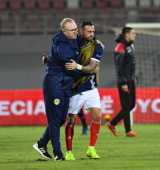 Scotland manager Alex McLeish (L) with Steven Fletcher at full-time.