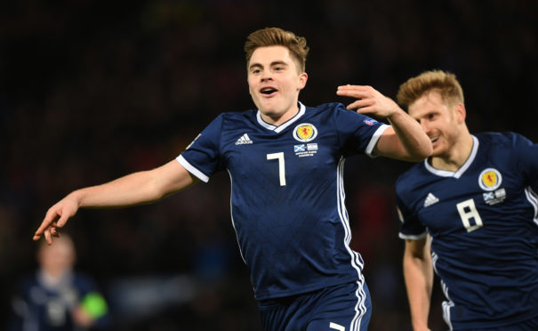James Forrest's treble helped Scotland to victory over Israel.