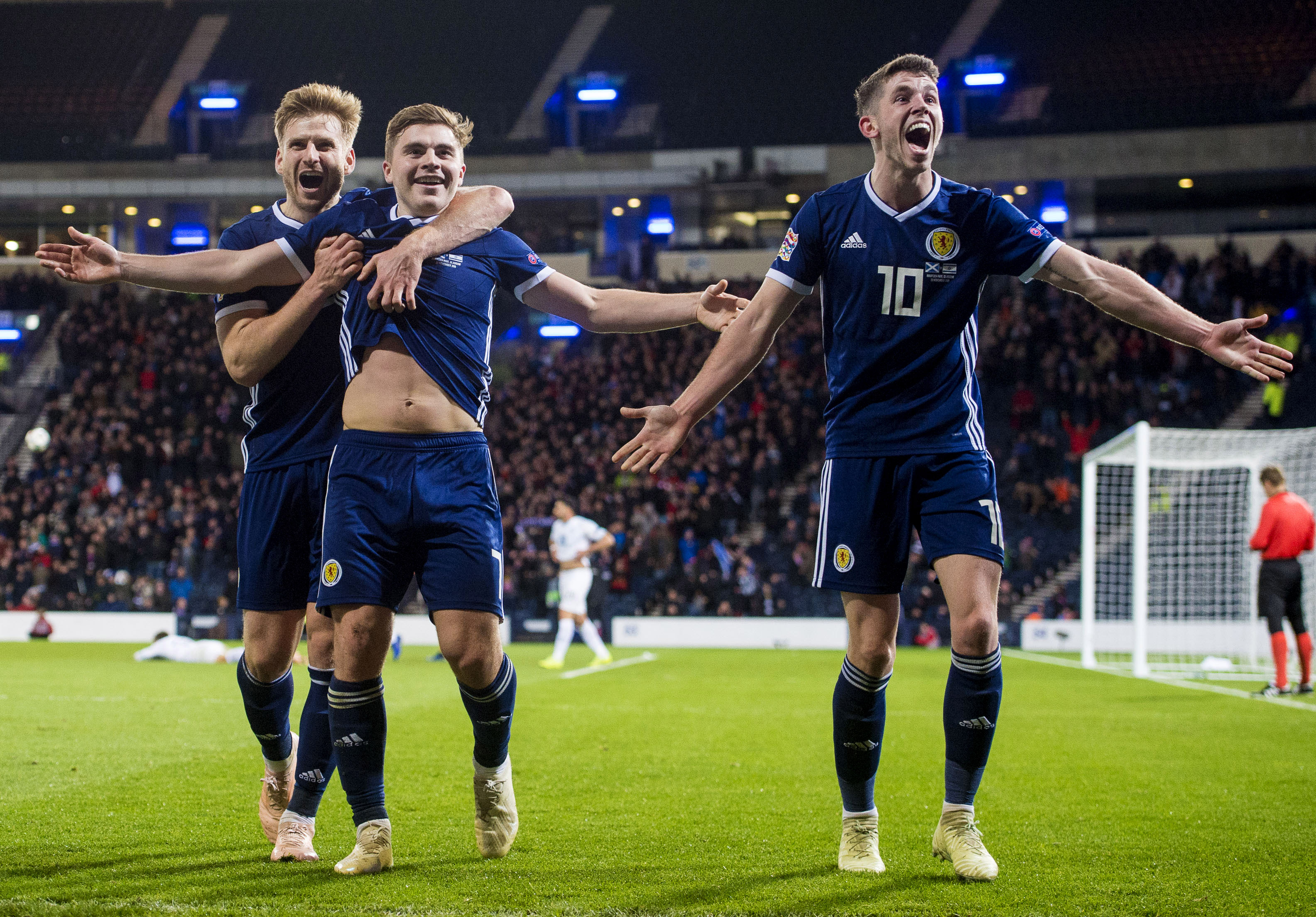 Ryan Christie celebrates with James Forrest and Stuart Armstrong on Tuesday night.