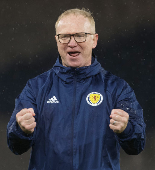 A very happy Scotland manager Alex McLeish celebrates at full time