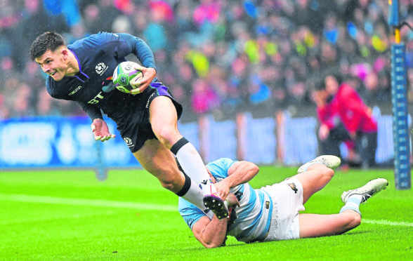 Blair Kinghorn is tackled by Argentinas Tomas Lavanini