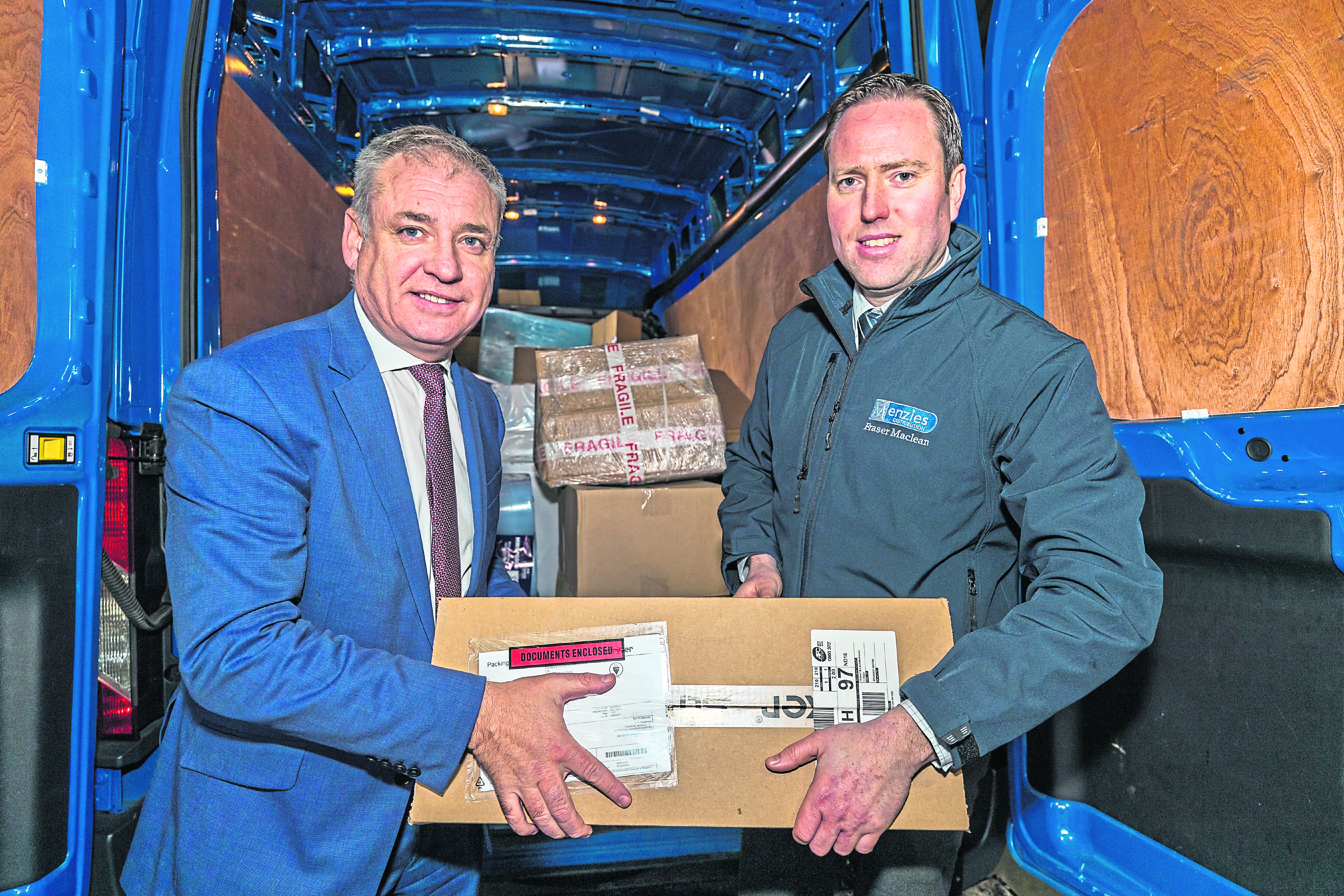Richard Lochhead MSP and Fraser Maclean, general manager of Parcel Logistics at Menzies Distribution.