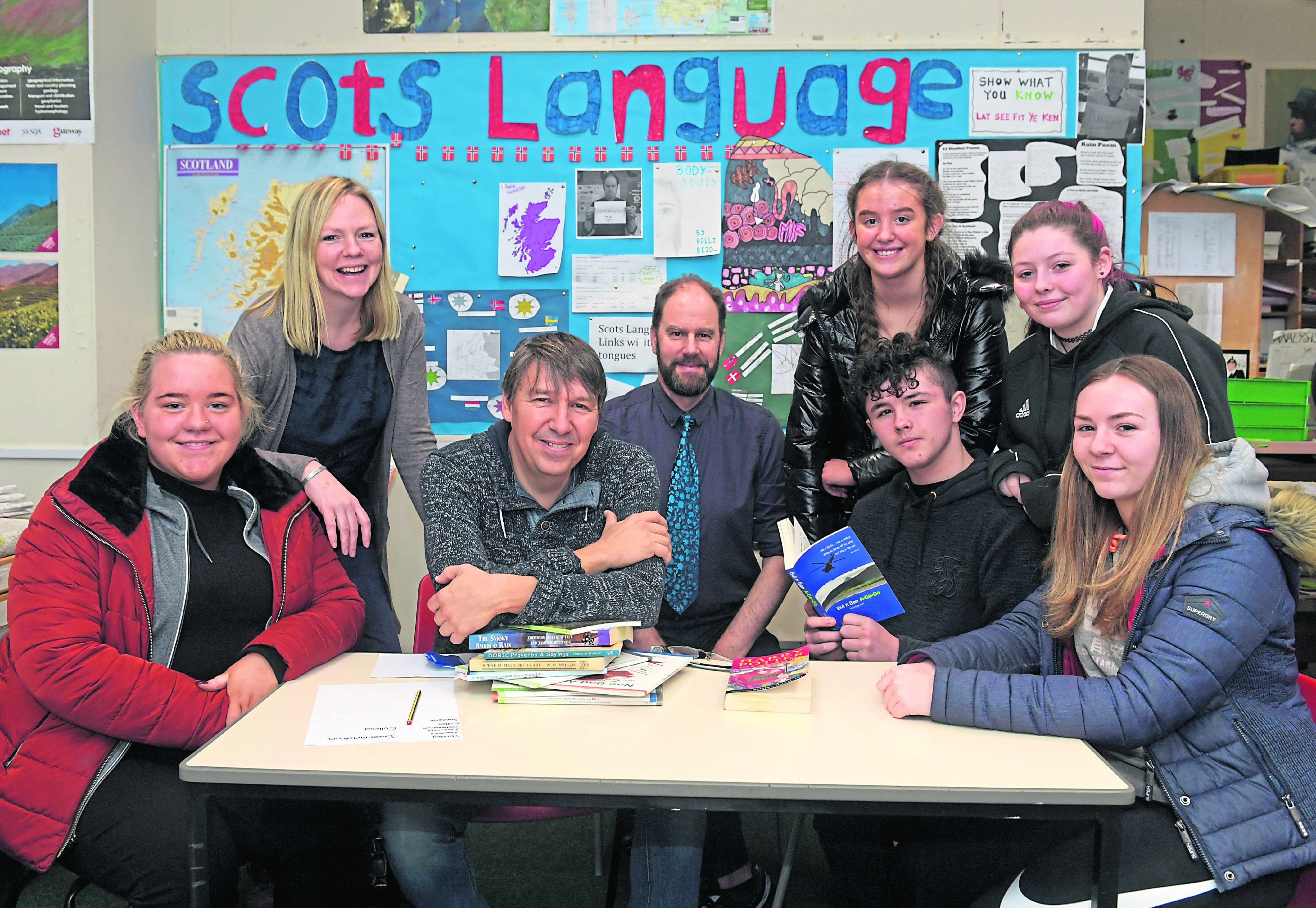 Banff Academy have teamed up with Aberdeen University to examine the benefits of studying towards the Scots Language Award. From left, Libby Wilson, the university's Claire Needler, poet and novelist Matthew Fitt, Humanities teacher Dr Jamie Fairbairn, Emma Twatt, Richie Duncan, Jaymi Sivewright and Ellie Narron.
Picture by Kath Flannery.