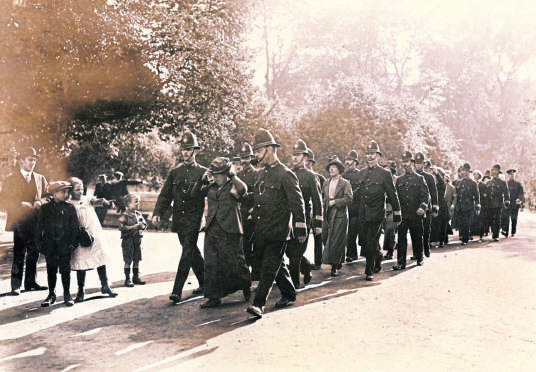 Suffragettes are pictured marching in London in the lead-up to women securing voting rights on November 21, 1918.