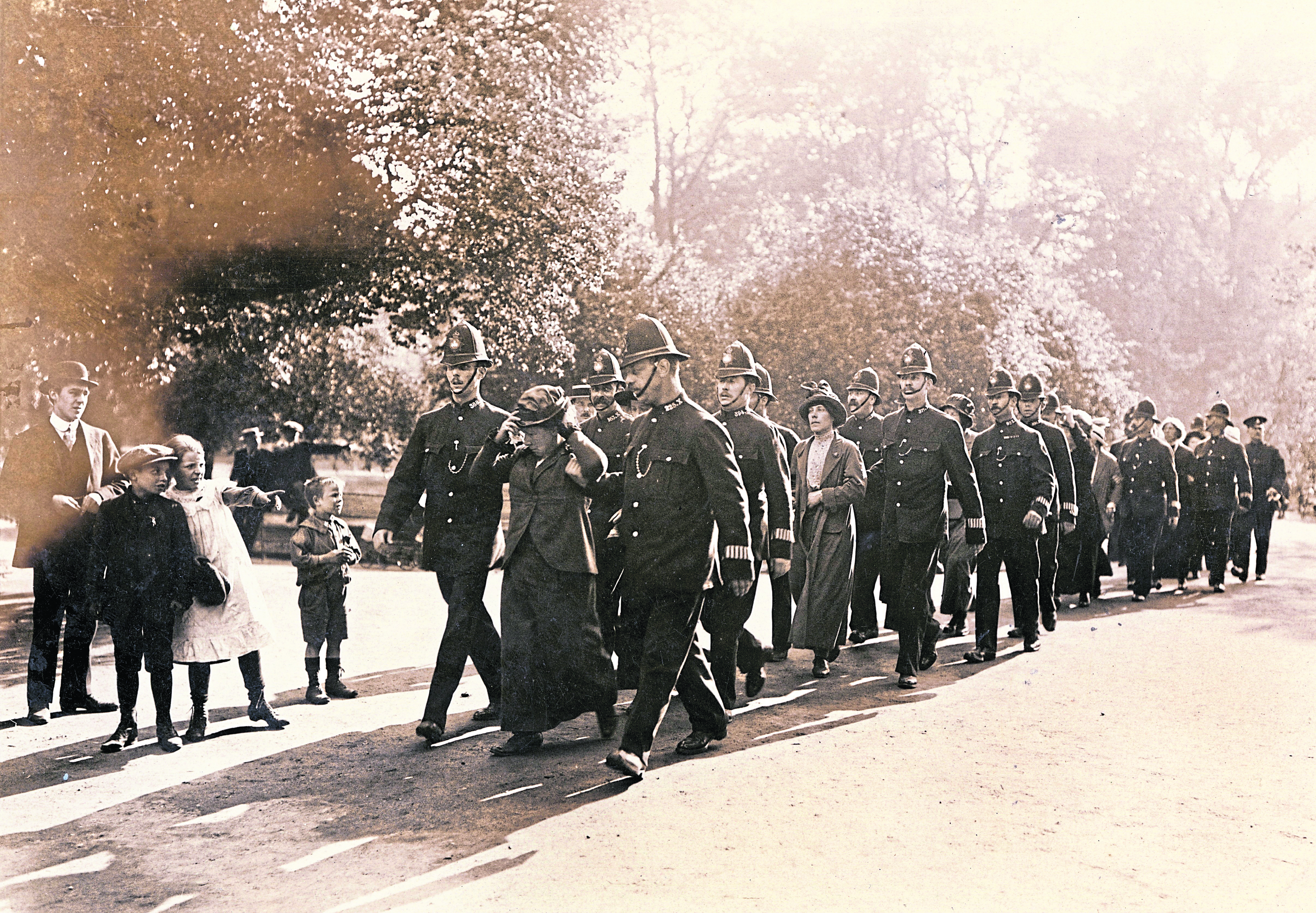 Suffragettes are pictured marching in London in the lead-up to women securing voting rights on November 21, 1918.
