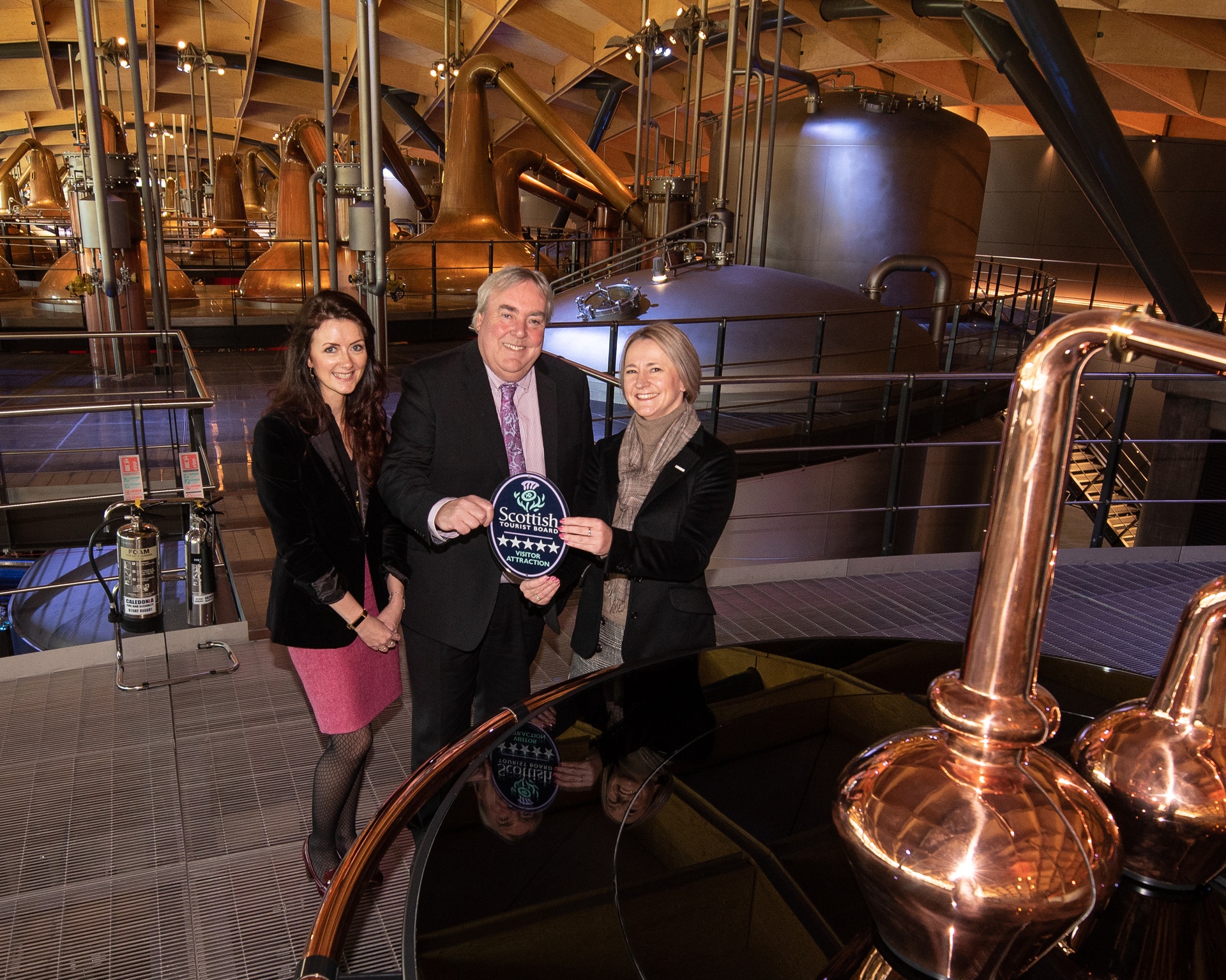 VisitScotland Chief Executive, Malcolm Roughead presents General Manager at The Macallan, Gail Cleaver with a five-star VisitScotland quality assurance award. They are joined by VisitScotland Regional Director, Jo Robinson.