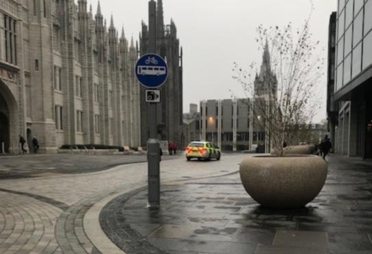 A police car travelling along Broad Street on the morning of November 6 , 2018